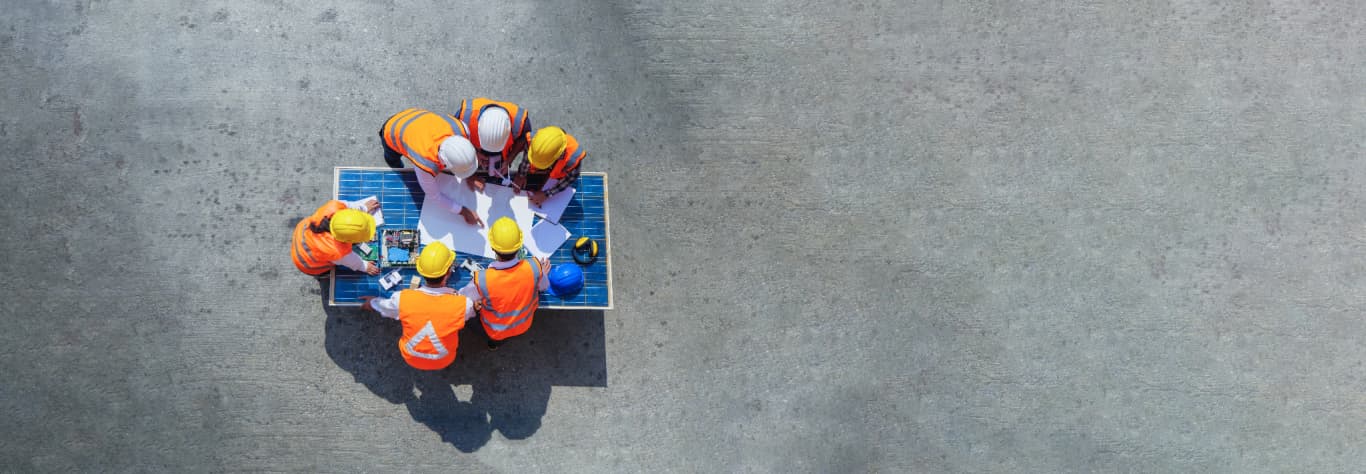 construction workers around table